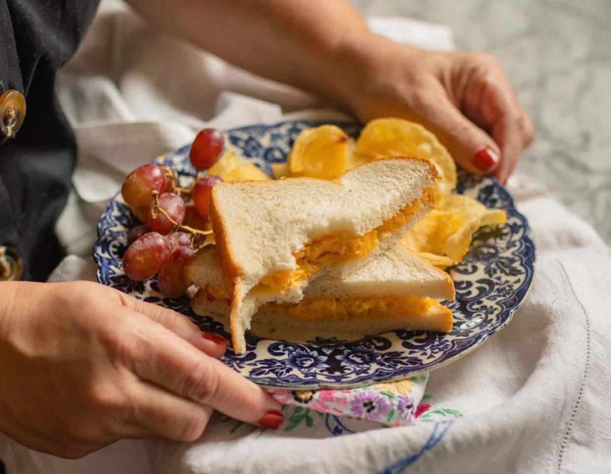 Masters pimento cheese sandwich on a plate, inspired by Augusta National Golf Club tradition