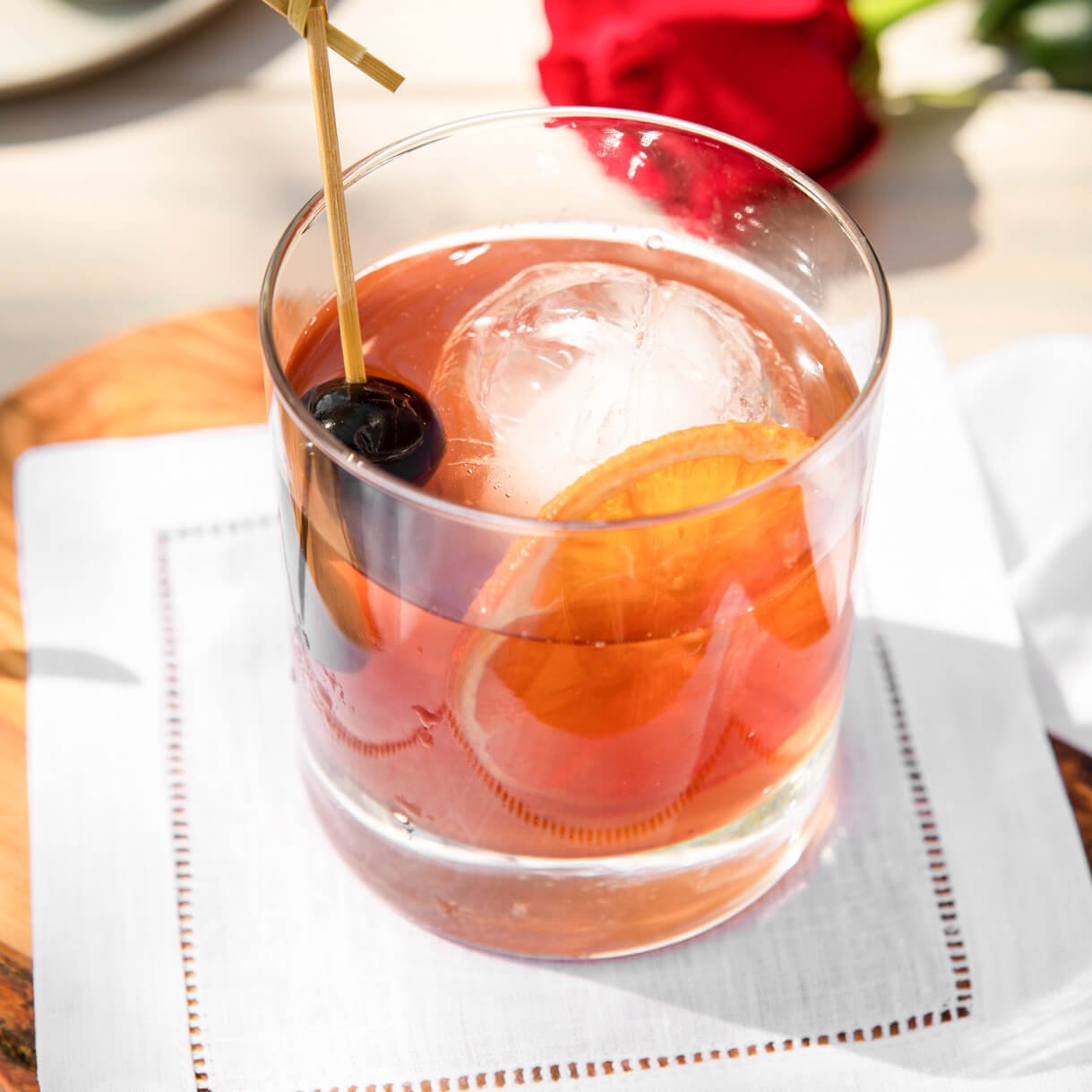 Classic Old Fashioned bourbon cocktail in a rocks glass with Boozy Cherries® garnish and orange rind