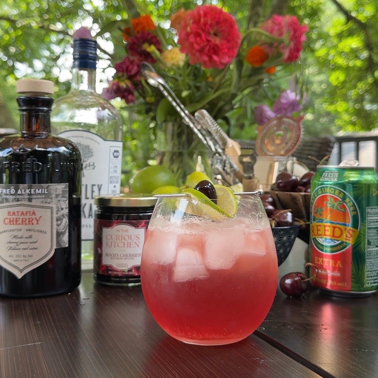 Boozy Cherry Mule cocktail with vodka, cherry liqueur, fresh lime juice, and ginger beer, garnished with Boozy Cocktail Cherries and a lime wheel.
