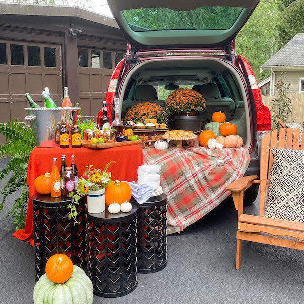 Southern tailgate spread with charcuterie board, cocktails, and game day snacks from In the Curious Kitchen