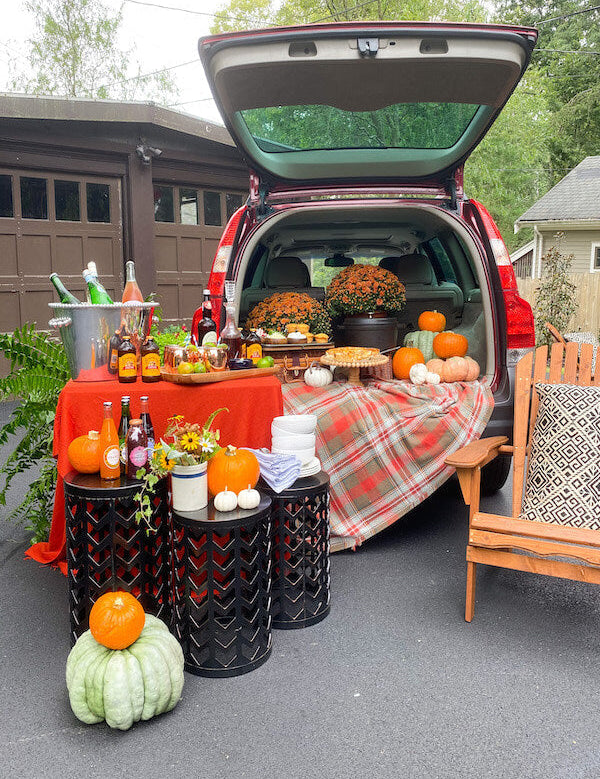 Southern tailgate spread with charcuterie board, cocktails, and game day snacks from In the Curious Kitchen