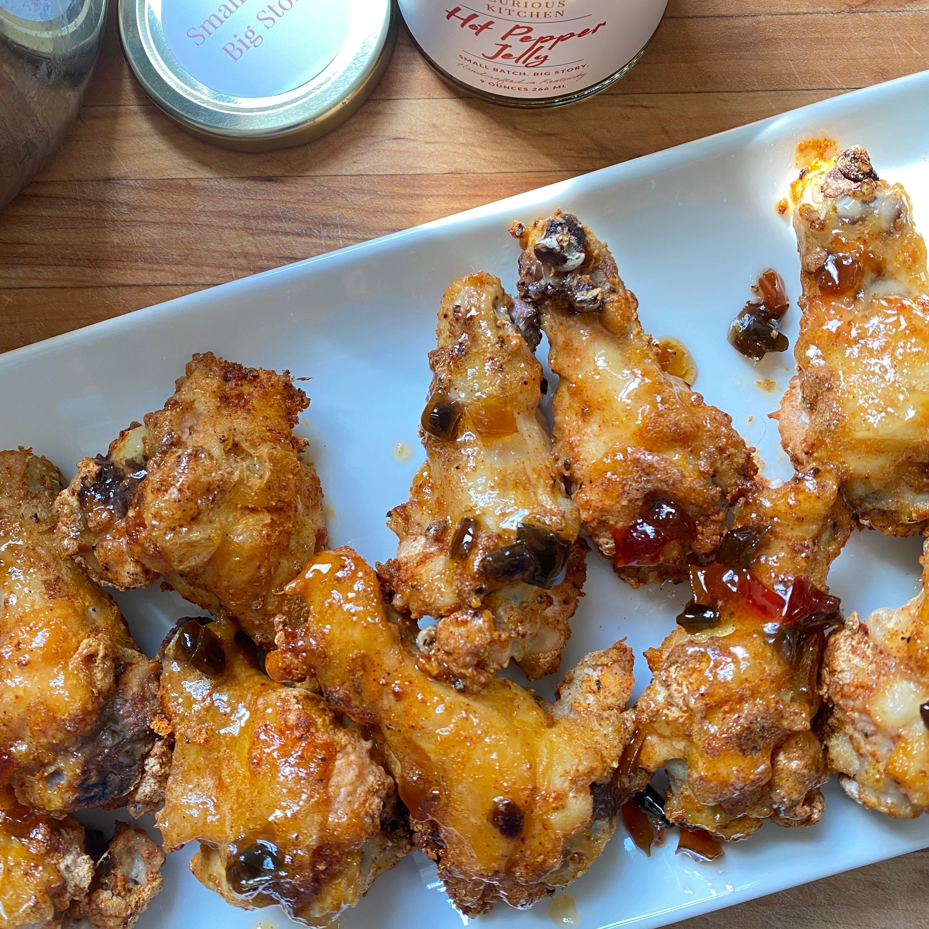 Chicken Wings glazed with In the Curious Kitchen Hot Pepper Jelly