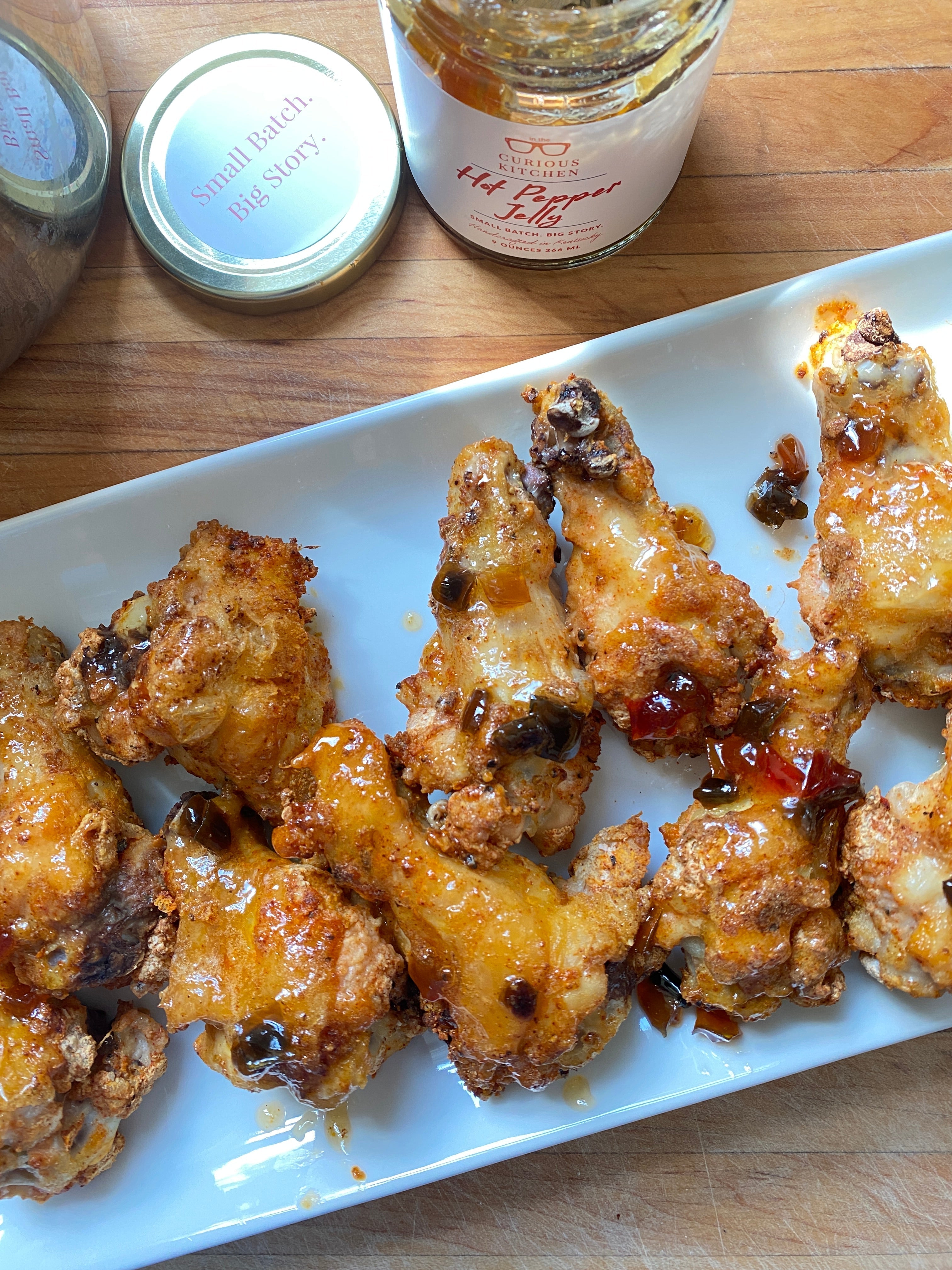 Chicken Wings glazed with In the Curious Kitchen Hot Pepper Jelly