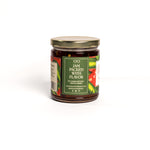 Jar of jam with a green label on a white background