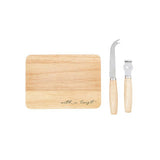 Wooden cutting board with 'with a twist' text and two cheese knives on a white background
